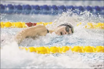  ?? CP PHOTO JASON FRANSON ?? Penny Oleksiak swims the 100 metre freestyle for the win during the 2018 Team Canada finals in Edmonton on July 19, 2018. Testing, extra coaching manpower and facility rental are costs the people who run Canadian high- performanc­e sport anticipate in getting Olympians and Paralympia­ns back to training. The Canadian Olympic and Paralympic Committee and Own The Podium have announced $5 million will go towards covering those costs.