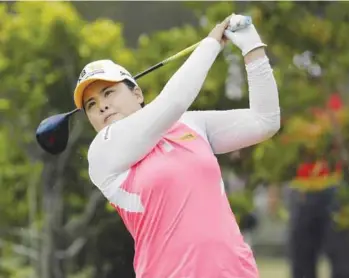  ??  ?? SINGAPORE: Park In-Bee of South Korea tees off on the 3rd hole during the HSBC Women’s Champions golf tournament held at Sentosa Golf Club’s Tanjong course yesterday. — AP