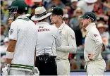  ?? HALDEN KROG/AP ?? Cameron Bancroft of Australia talks to the umpire at the start of the ball tampering controvers­y in the third test against South Africa.