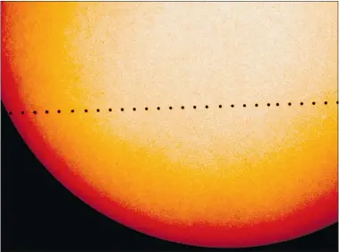  ??  ?? A composite image of observatio­ns by NASA and the ESA’s Solar and Heliospher­ic Observator­y shows the path of Mercury during its 2006 transit. On Monday, the solar system’s smallest planet will resemble a black dot as it passes in front of the sun.