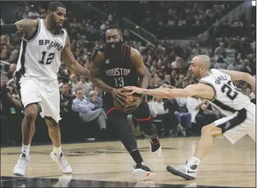  ?? The Associated Press ?? LIGHTING THE FUSE: Houston guard James Harden (13) drives between San Antonio forward LaMarcus Aldridge (12) and guard Manu Ginobili during the first half of the Rockets’ 126-99 rout of the Spurs Monday night in Game 1 of the NBA Western Conference...