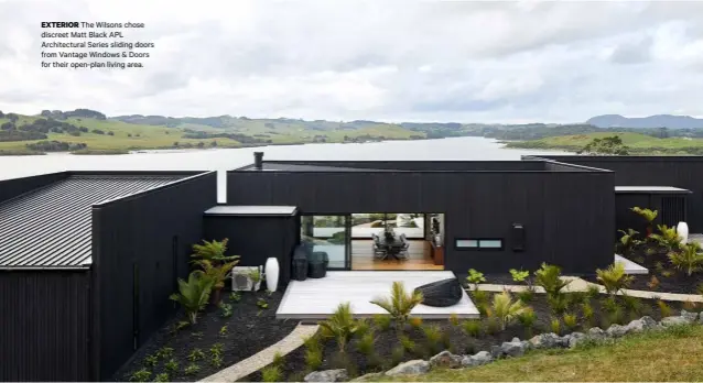  ??  ?? EXTERIOR The Wilsons chose discreet Matt Black APL Architectu­ral Series sliding doors from Vantage Windows & Doors for their open-plan living area.