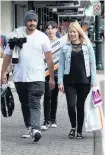  ?? PHOTO: LINDA ROBERTSON ?? Easter treats . . . Shoppers stroll down George St with full bags as a fourday weekend winds down yesterday.