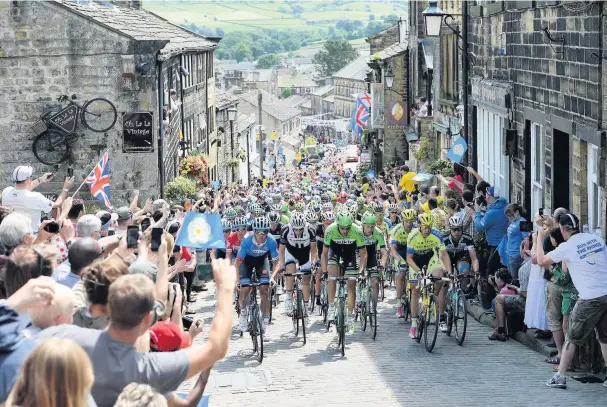  ?? MARTIN RICKETT ?? Britain hosted the Tour de France Grand Depart in Yorkshire in 2014