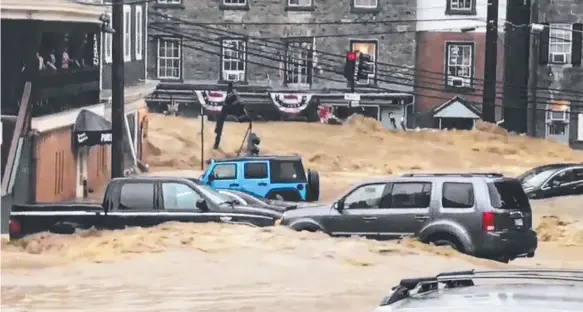  ?? Picture: LIBBY SOLOMON/AP ?? Water rushes through the historic Main Street of Ellicott City, Maryland, in the US on Sunday.