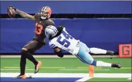  ?? Tom Fox / TNS ?? Browns wide receiver Odell Beckham Jr. (13) crosses the goal line for a long fourth-quarter touchdown as Cowboys middle linebacker Jaylon Smith (54) hangs on during Sunday’s game.