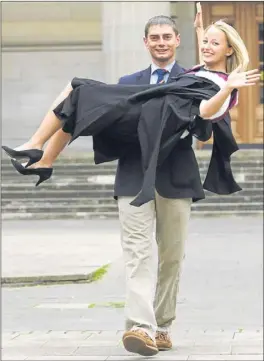  ??  ?? Graduating in dentistry — Kate Porter in the arms of her boyfriend Simon Ivinson.