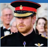  ??  ?? LOVE TOKEN: Meghan Markle sporting a gold and diamond thumb ring last week. Right: Prince Harry at an official engagement on Thursday