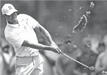  ?? AP Photo/David Dermer ?? SWING. Tiger Woods follows through on his swing on the ninth hole during the first round of the Memorial golf tournament Thursday, May 31, 2018, in Dublin, Ohio.