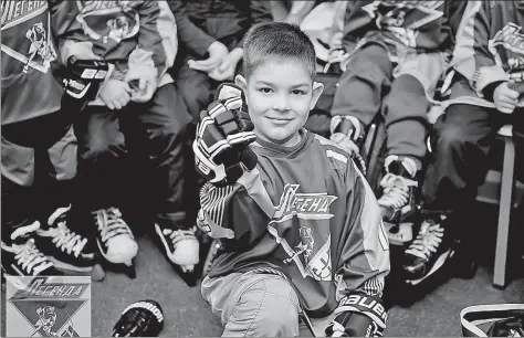  ?? XINHUA ?? Face of the future: A young Russian player strikes a pose at Legend Hockey Club in St. Petersburg. The club was founded late last year by China-born Wang Fei, with the aim of introducin­g more youngsters to the joy of the sport.