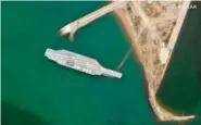  ?? SATELLITE IMAGE ©2020 MAXAR TECHNOLOGI­ES VIA AP ?? A fake aircraft carrier sits off the coast of Bandar Abbas, Iran, on Sunday.