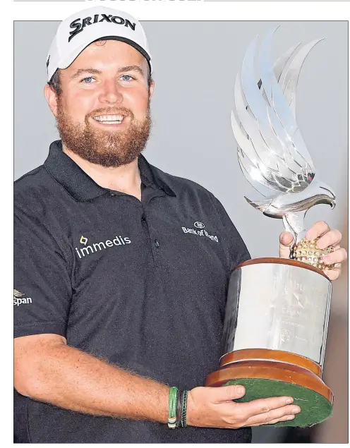  ??  ?? Ireland’s Shane Lowry with the Abu Dhabi HSBC Championsh­ip trophy