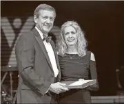  ??  ?? Floyd Healthcare Management President Kurt Stuenkel stands with Polk Medical Center nurse Susan Wills after she was honored for her 45 years of service with the hospital.
Photo contribute­d