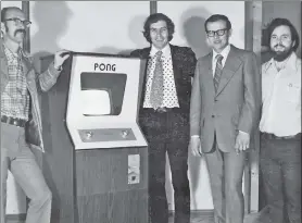  ?? ?? TOTAL PLAYERS: Atari co-founders Ted Dabney (from left) and Nolan Bushnell, head of finance Fred Marincic and engineer Al Alcorn strike a pose with a Pong machine in 1973, a year after launching the company.