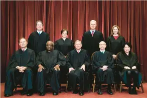  ?? ERIN SCHAFF/AP ?? Members of the Supreme Court assemble April 23, 2021. Seated from left are Associate Justice Samuel Alito, Associate Justice Clarence Thomas, Chief Justice John Roberts, then-associate Justice Stephen Breyer and Associate Justice Sonia Sotomayor, Standing from left are Associate Justice Brett Kavanaugh, Associate Justice Elena Kagan, Associate Justice Neil Gorsuch and Associate Justice Amy Coney Barrett.