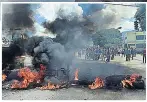  ??  ?? VIOLENCE Protest barricade in Venezuela