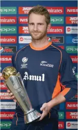  ?? — AFP ?? New Zealand’s captain Kane Williamson poses with the trophy prior to addressing a press conference.