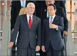  ?? [FRANCK ROBICHON/POOL] ?? Vice President Mike Pence listens to Japanese Deputy Prime Minister Taro Aso on their way Tuesday to a meeting at Prime Minister Shinzo Abe’s official residence in Tokyo.