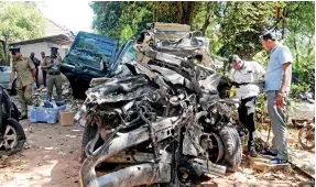  ?? Pix by Indika Handuwala ?? All that was left of the state minister's vehicle.