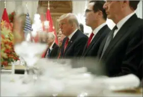  ?? PABLO MARTINEZ MONSIVAIS - THE ASSOCIATED PRESS ?? President Donald Trump, center, and Treasury Secretary Steve Mnuchin, second from the right, listen to remarks by China’s President Xi Jinping during a bilateral meeting at the G20 Summit, Saturday, Dec. 1, in Buenos Aires, Argentina.