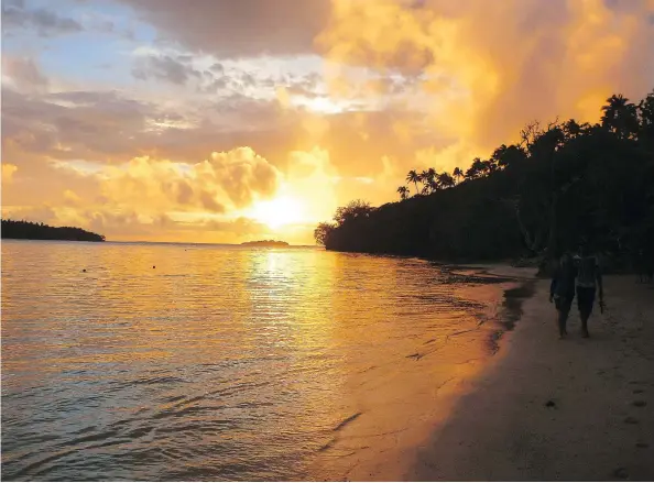  ?? BRIANNA RANDALL/FOR THE WASHINGTON POST ?? A leisurely sunset walk along Ofu island beach magically combines beautiful scenery and a relaxing atmosphere.