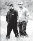  ?? ANDREW REDINGTON/GETTY ?? Shane Lowry of Ireland and Graeme McDowell, who was raised in Portrush, look on at the 18th hole.