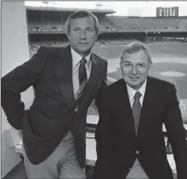  ?? (AP file photos) ?? ABOVE Al Kaline (left) and George Kell are seen in their broadcast booth July 3, 1979, at Tiger Stadium in Detroit. Over the course of his playing career in the 1940s and 1950s, and then as a broadcaste­r, Kell maintained his ties to the small Arkansas town of Swifton, where he was born in 1922. After a 1983 visit to Swifton, Kaline — who was Kell’s longtime broadcast partner — said the town is “a very nice place and they think the world of George there, which they should.” LEFT Kell, playing for the Detroit Tigers, warms up before a game against the New York Yankees on June 7, 1950, at Yankee Stadium.