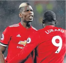  ??  ?? Paul Pogba congratula­tes Romelu Lukaku after scoring Manchester United’s third goal against Stoke.