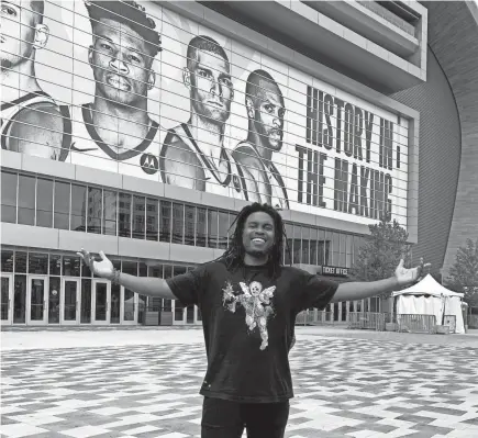  ??  ?? Los Angeles rapper Vo Williams' "History in the Making" has been the theme song for the Milwaukee Bucks' championsh­ip-striving season. Williams (pictured here before Sunday's Finals game at Fiserv Forum) also made the song, "Ready, Set," that was used by the Tampa Bay Lightning for their Stanley Cup-clinching season this year.