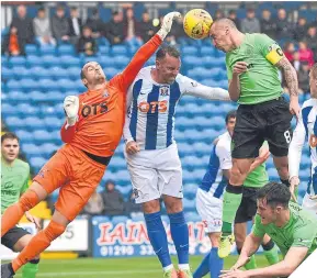  ??  ?? Jamie MacDonald (left) and Kris Boyd battle with Scott Brown.