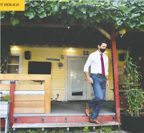  ?? JENNIFER GAUTHIER / REUTERS ?? Liberal Leader Justin Trudeau exits a home in Surrey, B.C., during a campaign tour stop last month. In Greater Vancouver, the price
for a home has increased $300,000 since November and the average detached home in the region now sells for roughly $1.8 million.