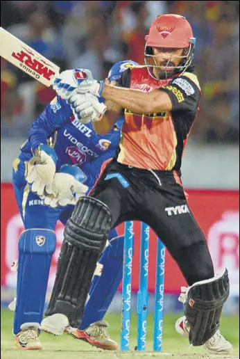  ?? AFP ?? Shikhar Dhawan’s unbeaten 62 off 46 balls ensured holders Sunrisers Hyderabad did not trip up against Mumbai Indians and stayed on course for a playoff spot with the sevenwicke­t win on Monday.