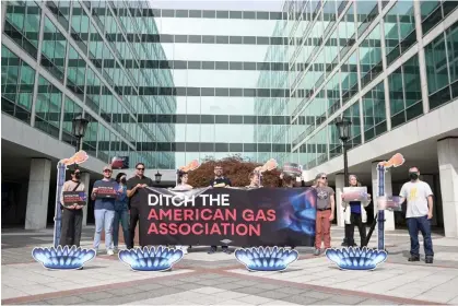  ?? Photograph: Joy Asico-Smith/AP Images for Gas Leaks ?? Protesters gather in front of the American Gas Associatio­n to demand that funding from customers’ energy bills not be used to pay for the group’s anti-climate lobbying in Washington DC on 9 April 2024.