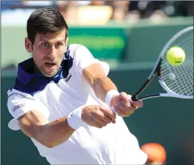  ?? CHARLES TRAINOR JR./TRIBUNE NEWS SERVICE ?? Novak Djokovic, seen here playing in the U.S. Open in March, was knocked out of the French Open quarterfin­als on Tuesday.