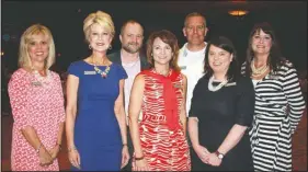  ?? NWA Democrat-Gazette/CARIN SCHOPPMEYE­R ?? Jan Shinall (from left) Susan Goss, Bryan Looney, Jayci Schmitt, Mark Gerth, Julie Gehr ki and Brittney Duke, Saving Grace board members, welcome guests to the group’s Butterflie­s and Blooms luncheon.