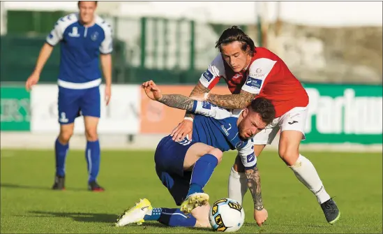  ??  ?? Sligo Rovers’ Rhys McCabe battles with Limerick’s Lee-J Lynch. Pic: Conor Wyse.