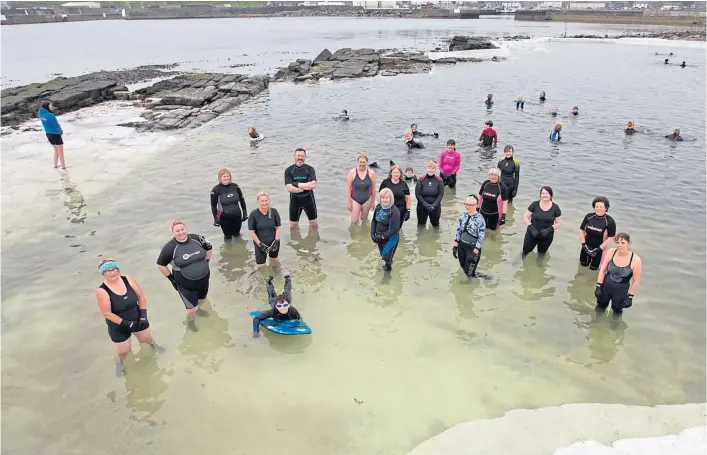  ??  ?? TAKING THE PLUNGE: Members of Kool Water Swimmers at North Baths in Wick are looking to raise at least £15,000 to carry out proper repairs to the tidal pool.