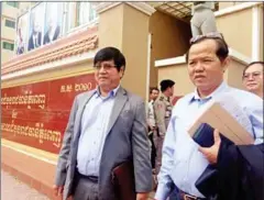  ?? NIEM CHHENG ?? CPP social media official Som Soeun exits the Phnom Penh Municipal Court yesterday after winning a defamation case against opposition leader Sam Rainsy.