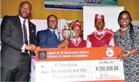  ??  ?? L-R:The Special Adviser to the Governor on Education, Mr. Obafela Bank-Olemoh; Special Adviser to the Governor on Communitie­s and Communicat­ion, Mr. Kehinde Bamigbetan; winners of Lagos State School’s Debate, MasterTori­shade Abayomi and Miss Qodiat...