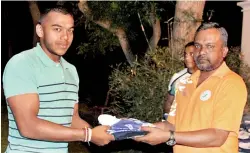  ??  ?? Navy SC skipper Yoshitha Rajapaksa receiving his No.7 flanker’s jersey from Navy Sports Club’s Chairman Rugby & Director Sports Commodore Deshapriya Hettiarach­chi at a ceremony in Beliatta last evening