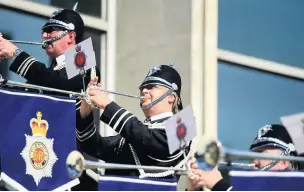  ??  ?? ●●Members of the police band greet guests with a fanfare of trumpets
