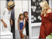  ?? FRED SQUILLANTE PHOTOS / COLUMBUS DISPATCH ?? Second-graders Eleanor Armstrong-Phillips (left) and Janyla Williams react as they enter first-grade teacher Meghan Davis’ redesigned classroom, the girls’ former room, at Wilson Hill Elementary School in Worthingto­n.