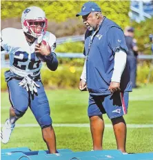  ?? STAFF FILE PHOTO BY NANCY LANE ?? GOOD RECEPTION: Patriots running backs coach Ivan Fears watches James White, a favorite target of Tom Brady, run through a drill during training camp.