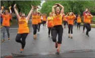  ?? BARRY TAGLIEBER — FOR DIGITAL FIRST MEDIA ?? Zumba dancers show off their moves along the Dogwood Parade route in Phoenixvil­le.