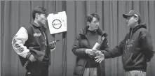  ?? SCREENSHOT­S FROM XINHUA VIDEO ?? Right: Nyanzin Drakpa (right) goes over details of a show with other members of his comedy team called Shwow.