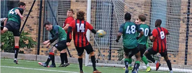  ?? ?? ●●Action from Village v Didsbury Athletic (Didsbury in red and black)