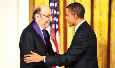  ?? —AFP ?? In this file photo US President Barack Obama shakes hands with graphic designer Milton Glaser after presenting him with the 2009 National Medal of Arts during a ceremonyin the East Room of the White House in Washington, DC.