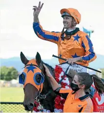  ?? RACE IMAGES NI ?? Southern jockey Jason Laking and Belle En Rouge after upsetting in the NZ Oaks at Trentham yesterday.