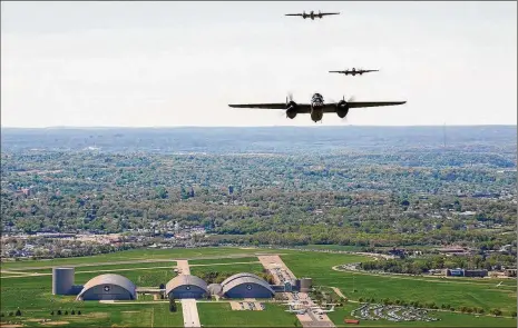  ?? TECH. SGT. JACOB N. BAILEY / U.S. AIR FORCE ?? Vintage B-25 Mitchell bombers fly over the National Museum of the U.S. Air Force at Wright-Patterson Air Force Base during a memorial flight honoring the Doolittle Tokyo Raiders on April 18, 2010.