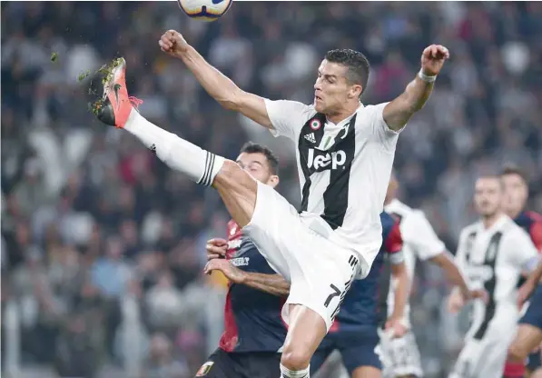  ?? — AFP ?? Juventus’ Cristiano Ronaldo controls the ball during the Serie A match at the Juventus Allianz stadium in Turin.
